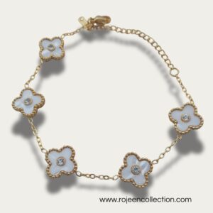 Golden clover bracelet with elegant clover design in white and green color.